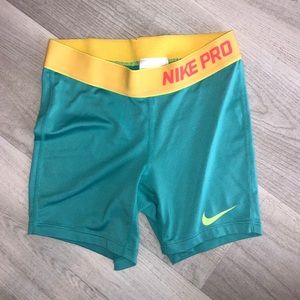 teal/yellow/neon pink youth nike pros